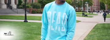 Petty Professor Read the Syllabus crewneck styled on university campus