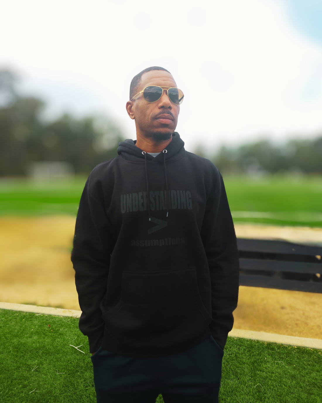 Understanding > Assumptions Hoodie